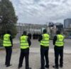 Four Qwik Security event guards in high-visibility vests at Federation Square, Melbourne